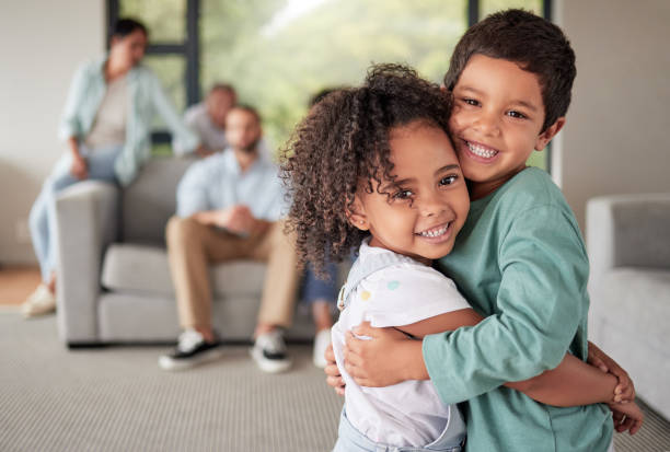 Children hug, happy family and portrait of kids with love together in lilving room of house, smile for affection and bonding in the lounge of home. Girl and boy siblings hugging in happiness Children hug, happy family and portrait of kids with love together in lilving room of house, smile for affection and bonding in the lounge of home. Girl and boy siblings hugging in happiness sibling stock pictures, royalty-free photos & images