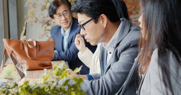 istock Asian Freelancers Working in Cafe 1446092906