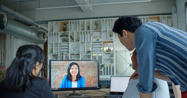 istock Asian Office Workers Joining Colleagues in Video Conference 1446092971