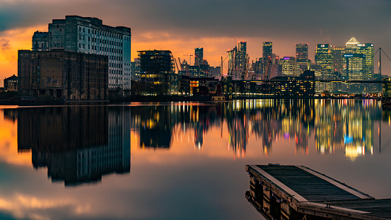 Canary Wharf and Isle of Dogs skyline at dusk in. The city of London