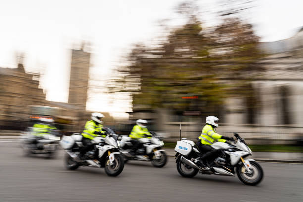 Police motorbikes at Westminister, London Police outriders outside houses of parliament in Westminster royal albert hall stock pictures, royalty-free photos & images