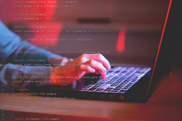 istock Girl works on a laptop at night, coding and creating project. 1446095415