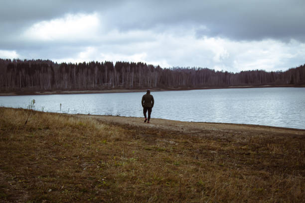 istock A man walks by the lake 1446097318