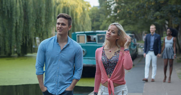 istock Couples Walking by Regents Canal in London 1446097825