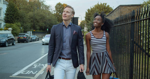 istock 30 Something Couple Walking Down Street in Primrose Hill 1446097835