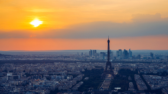 Panoramic aerial view of Paris, Eiffel Tower and La Defense business district. Aerial view of Paris at sunset. Panoramic view of Paris skyline with Eiffel Tower and La Defense. Paris, France.