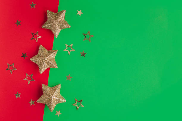 istock Golden sparkling stars on a red and green background. 1446100309