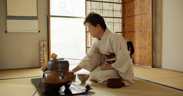 istock Elderly Tea Ceremony Host Measuring Out Hot Water 1446100566