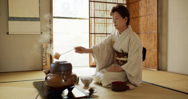 istock Elderly Tea Ceremony Host Measuring Out Hot Water 1446100573