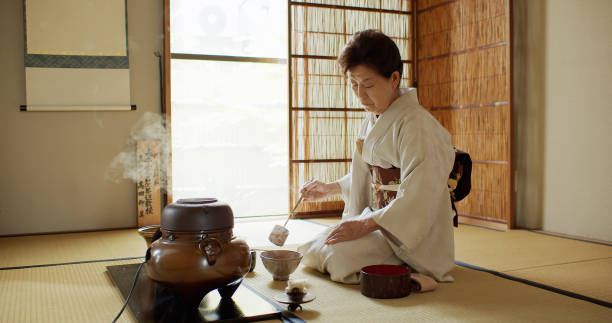 istock Elderly Tea Ceremony Host Measuring Out Hot Water 1446100575