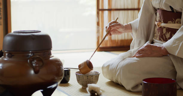 istock Japanese Ceremony Host Measuring Water Into Tea Bowl 1446100598