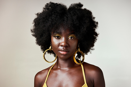 Black woman, afro or portrait of beauty, sexy or model with fashion, facial makeup or hair care with designer jewelry. Influencer, cosmetics art or skincare girl from Nigeria in white background