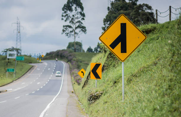 istock image of road traffic signs for caution and care while driving 1446103576