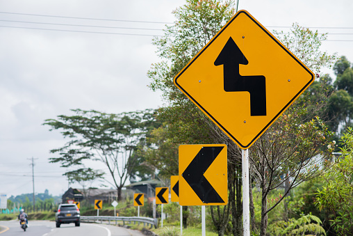 image of road traffic signs for caution and care while driving