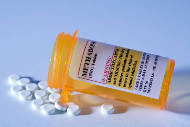 Dangerous prescription drug, Methadone pill Addictive Prescription drugs With Warning Labels. methadone stock pictures, royalty-free photos & images