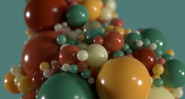 istock Colorful spheres on green background representing data technology science quantum mechanics 1446112537