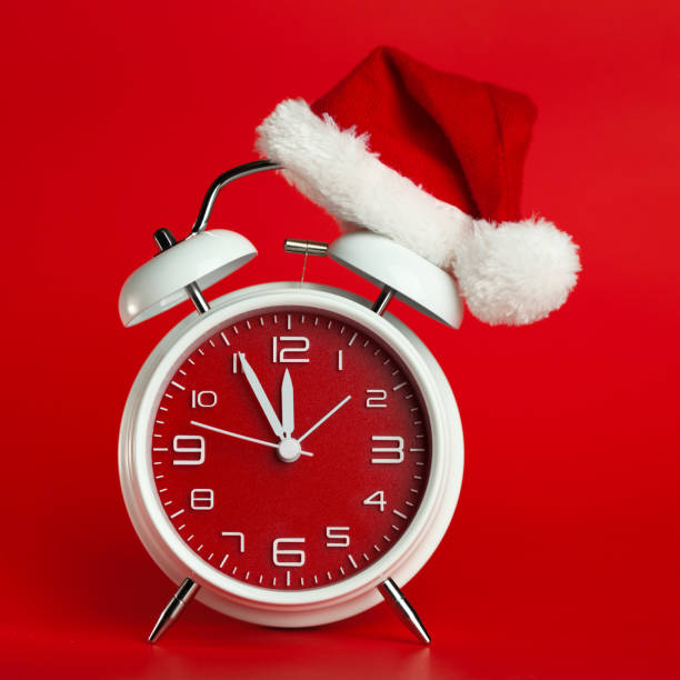 istock Red clock with Christmas Santa hat. Time for Christmas shopping concept. 1446112867
