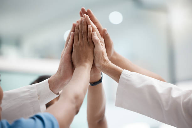 istock High five, teamwork and doctors hands in collaboration for mission, goal or team building together. Mindset, target or medical group with trust, motivation or support for vision, winning or success. 1446113427