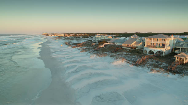 Seaside Houses at Grayton Beach, Florida at Dawn - Aerial View Aerial shot of Greyton Beach, Florida during sunrise in spring. A small historic village near Greyton Beach State Park. florida beach above stock pictures, royalty-free photos & images