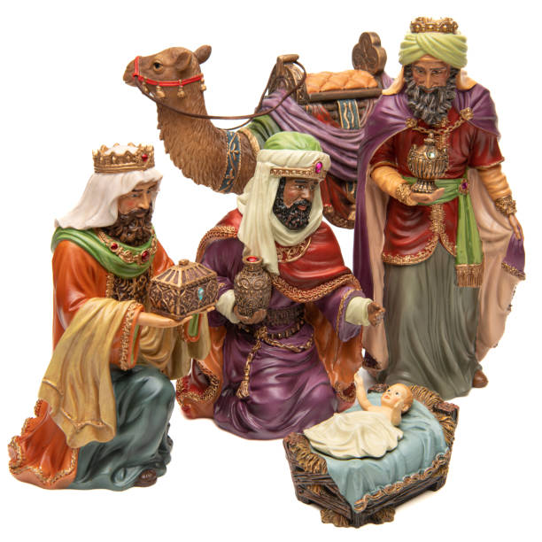 istock Adoration: Three wise men, camel, and baby Jesus figurines on white background 1446114885