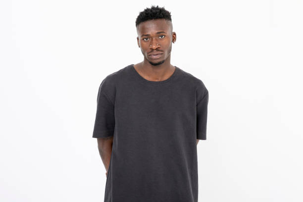 istock African descent young black man with gray t-shit against white background. 1446115616