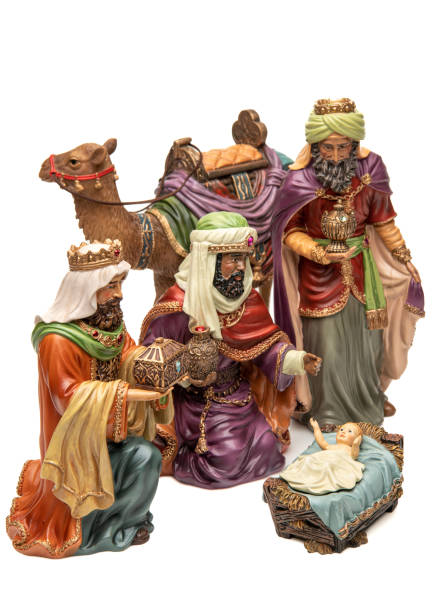 istock Adoration: Three wise men, camel, and baby Jesus figurines on white background 1446116569