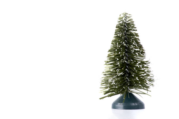 istock white light christmas card background with little ornament artificial christmas tree in the corner landscape 1446116777