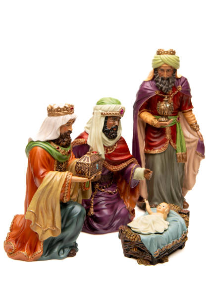 istock Adoration: Three wise men, and baby Jesus figurines on white background 1446116782