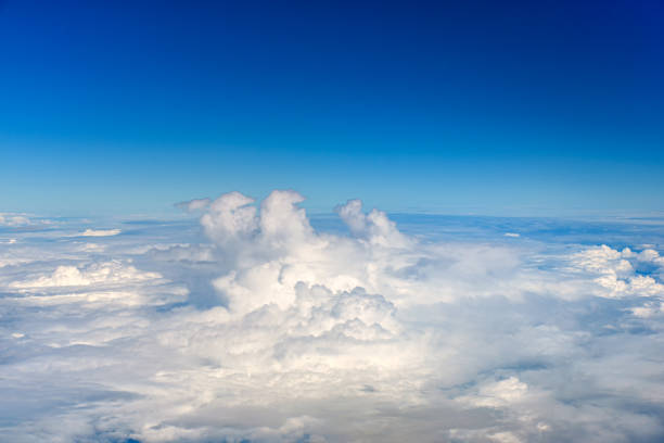 istock Clouds against blue sky view through an airplane window for a background. 1446117160