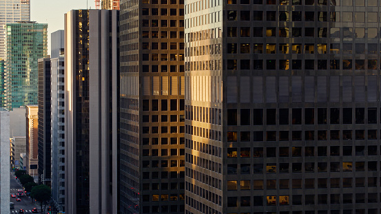 Aerial shot of skyscrapers in the Los Angeles Financial District at sunrise on a Fall morning. The Financial District is a densely populated urban area in Downtown LA, home to towering high-rises housing banks, law firms, and other financial institutions.