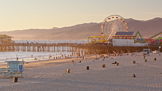 Aerial shot of the Santa Monica Pier in Santa Monica, California at sunset. Authorization was obtained from the FAA for this operation in restricted airspace.