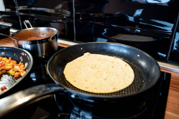 istock Preparing a homemade tortilla in a pan 1446119500