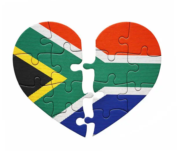 Photo of Broken-hearted South Africa: Heart-shaped jigsaw puzzle depicting the national flag, divided down the middle