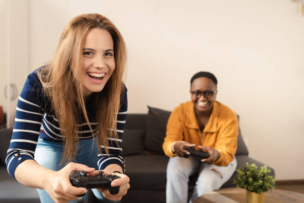 istock Sisters playing video game at home 1446121084