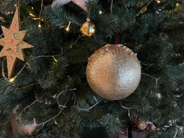 istock Christmas Tree with festively Decorations home interior beautiful ornaments and white sparkling lights.. Merry Christmas and Happy Holidays. 1446123537