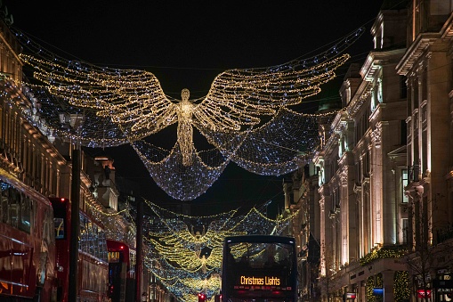 London, United Kingdom - November 27, 2022: Christmas lights on Regents Street London with event double decker bus