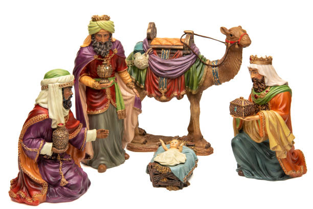 istock Adoration: Three wise men, camel, and baby Jesus figurines on white background 1446134168