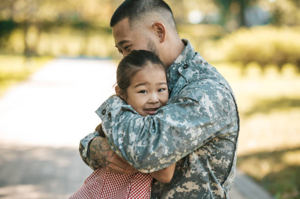 istock Service man hugging his little daughter and looking happy 1446135368