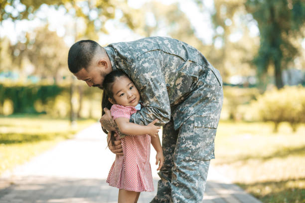 istock Service man hugging his little daughter and looking happy 1446135371