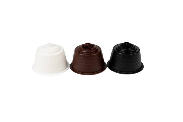 istock White, Brown and Black Coffee Capsules For Coffee machine. Isolate. High quality photo 1446135703
