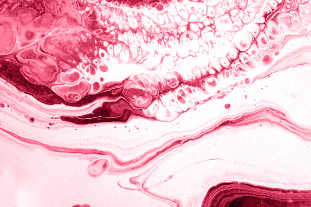 Spread-out acrylic paint. Abstract background, made in the technique of fluid art. Demonstrating the colors of 2023 - Viva Magenta stock photo