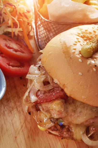 istock Hamburger with cheese and fried potatoes 1446156532