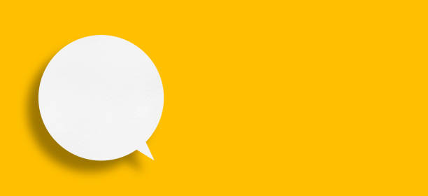 istock White paper in speech bubble shape set against yellow background. 1446159222