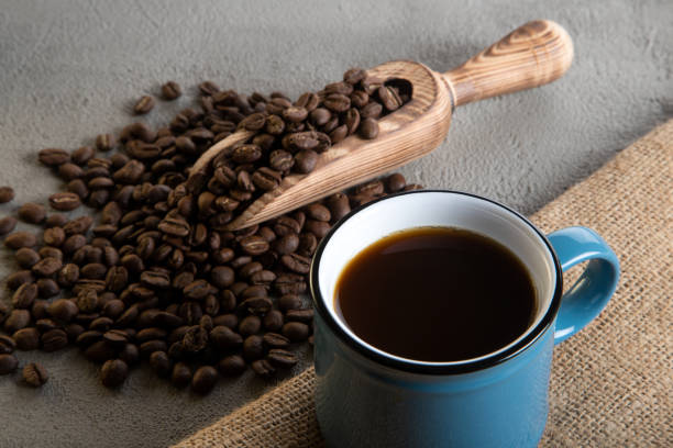 istock A blue cup of coffee with coffee beans, directly above 1446159353