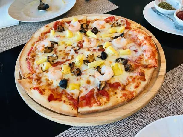 Photo of Dish of yummy Wood-Fired Pizza in Thailand.