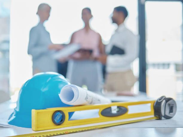 istock Equipment or architecture tools in an office of engineers planning during a meeting in a boardroom. Drawing or blueprint project on a workplace desk or table for construction design 1446161414