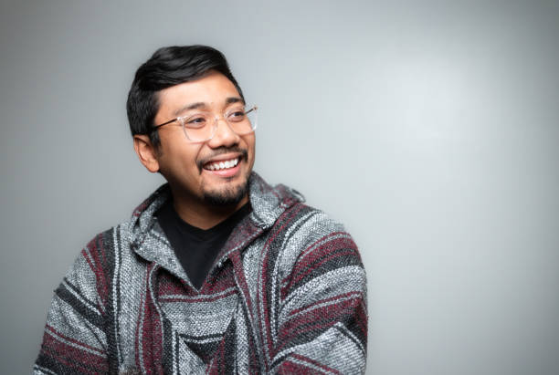 istock Studio Portrait - Mexican Baja Hoodie Pullover Sweater - Soft Grey Background - Positive Emotion - Turned 1446164638
