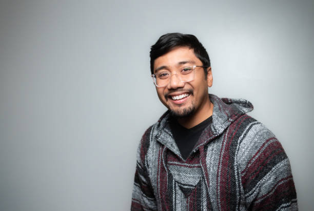 istock Studio Portrait - Mexican Baja Hoodie Pullover Sweater - Soft Grey Background - Positive Emotion - Slightly Turned 1446164675