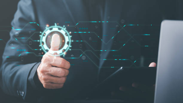 istock Cybersecurity Management with Online Authentication Technology , A businessman scans his fingerprints. to login through encryption and through authorization and authentication from the database 1446166012