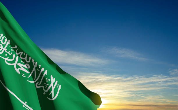 istock Saudi Arabia flag on sunset or sunrise background 1446169246
